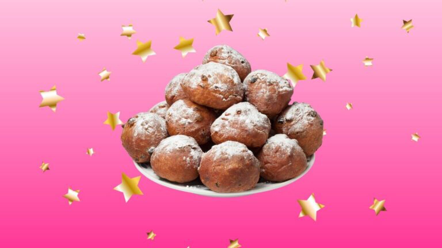 Schaal oliebollen met sterretjes op de achtergrond.