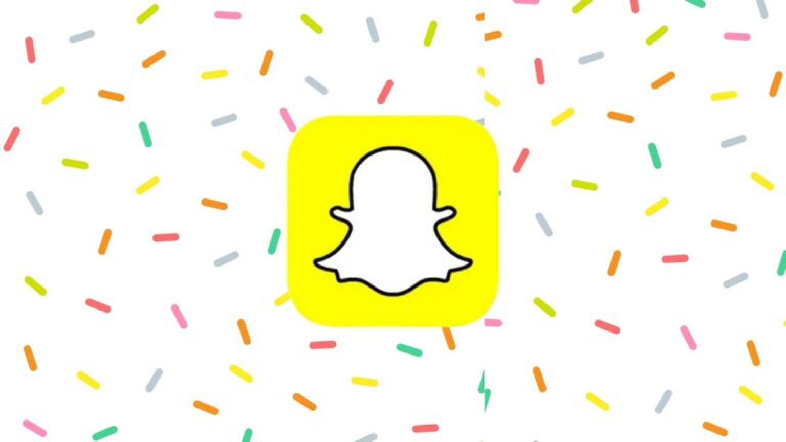 Foto van Snapchat-logo met een confetti achtergrond.