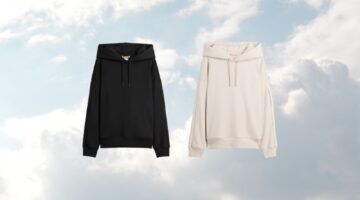 De Gap x BEÍS travel hoodie in zwart en beige, op een wolken achtergrond.