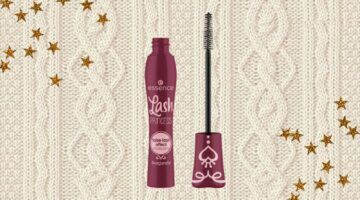 Bordeauxrode mascara van essence omringt door sterren.