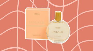 Foto van pafrum van Action, genaamd: Figenzi Noralie. De parfum is geplakt op een grafische achtergrond.