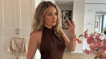 Joy Bosz die een spiegelfoto maakt in een jurk.