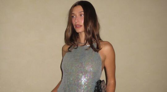 Hailey Bieber in glittertop.