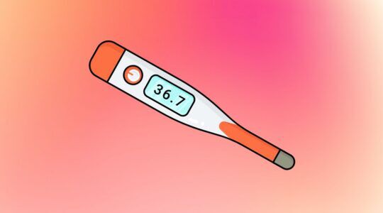Een thermometer met een kleurijke achtergrond.