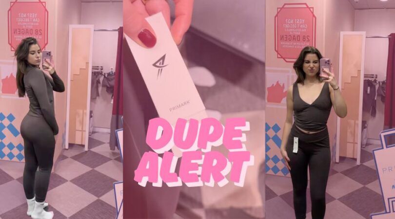 Meisje past de Primark set in de winkel.