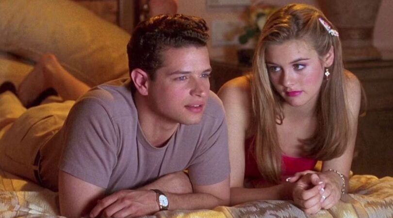 Sc&egrave;ne uit de film clueless. Vrouw en man liggen op bed. Vrouw kijkt heel teleurgesteld naar de man, die alleen maar interesse heeft in de film die ze kijken.