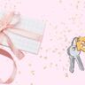 Een cadeautje en een huissleutel voor een roze glitterachtergrond