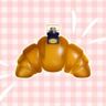 Foto van croissant-parfum van de Lidl, voor een roze geruite achtergrond.